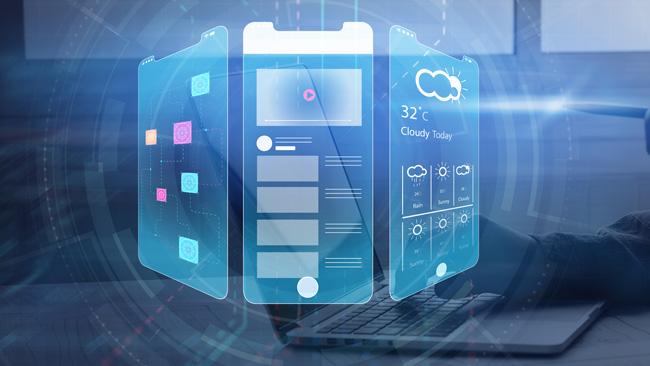 A digital illustration shows a futuristic, transparent smartphone interface displaying weather, social media, and app icons, hovering in front of a person using a laptop in a modern tech environment.